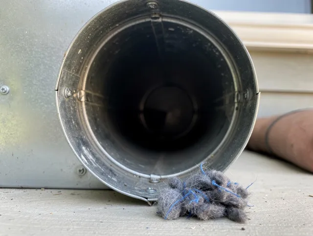 Brook Park Dryer Vent Cleaning technician using specialized equipment to clear severe dryer vent blockage in Brook Park
